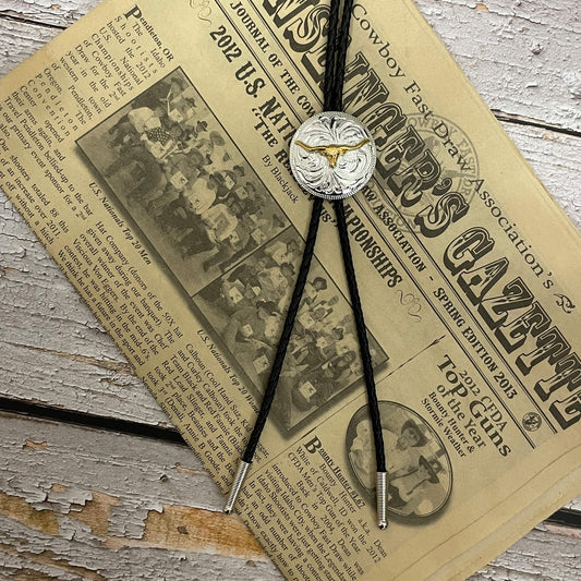 This men's western bolo tie features a round silver Concho with a gold longhorn motif. Black braided leather beautifully compliments the two-toned Concho. 