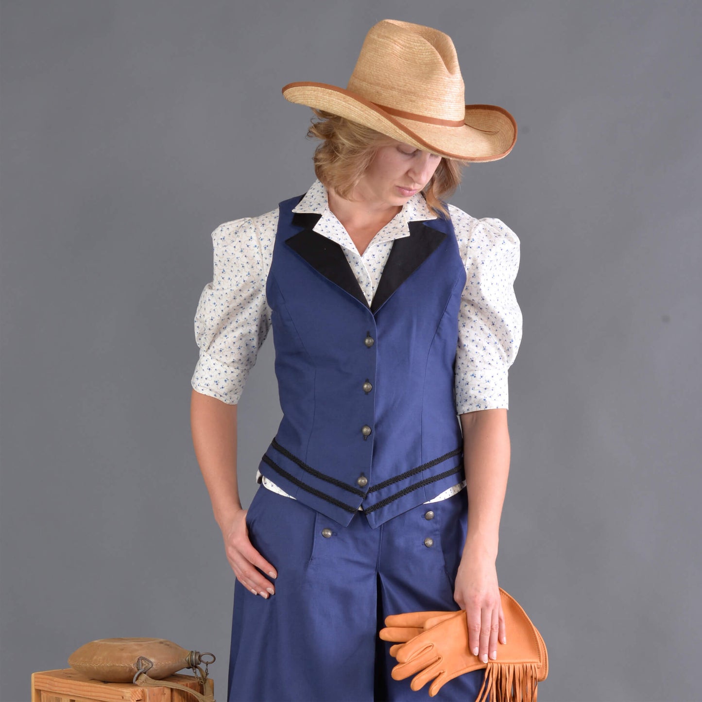 Our summer version to our riding jacket is this new Riding Vest. Stay cool in the summer heat or wear it with a blouse to stay warm and look great either way! Available in six great colors with black contrasting lapels and two rows of rayon black braid along the bottom. Silver engraved Victorian style buttons accent this vest and match our 1800’s riding skirt. Wear it with our matching riding skirts or with your favorite pair of jeans. Made of 100% cotton twill and lined in polyester.