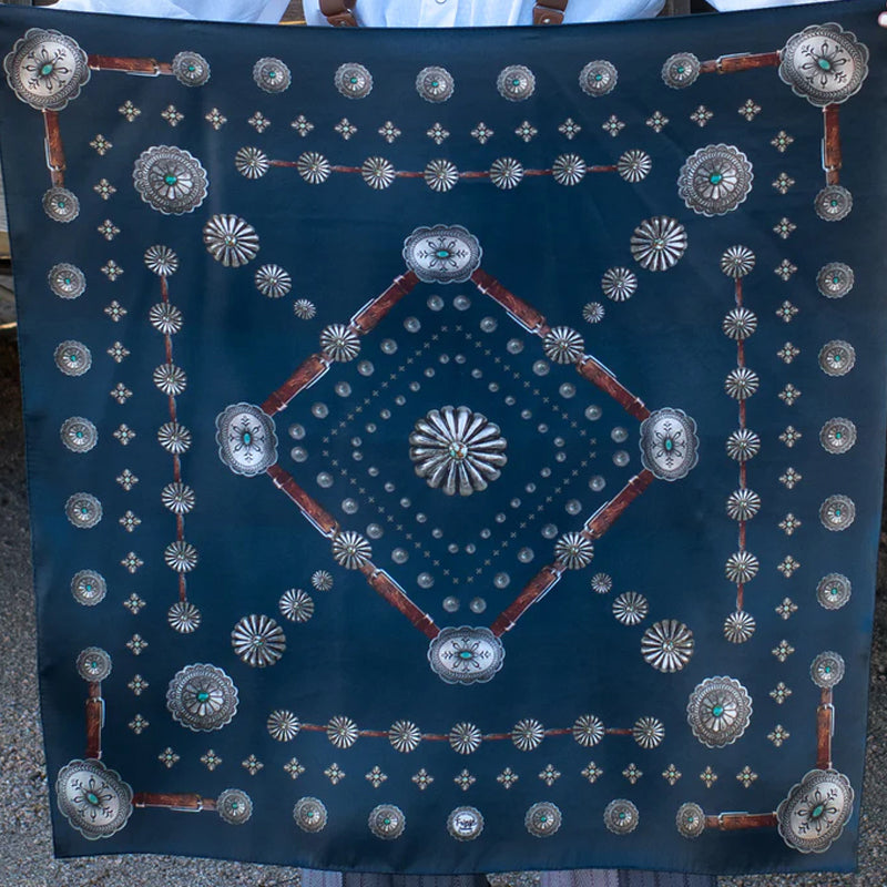 The Concho silk wild rag that has a rustic, vintage feel. A true classic! A vintage patina to this scarf to give it that distressed worn look. Dry clean preferred. Iron on silk setting or use steamer. 100% Satin Silk.  35" x 35"