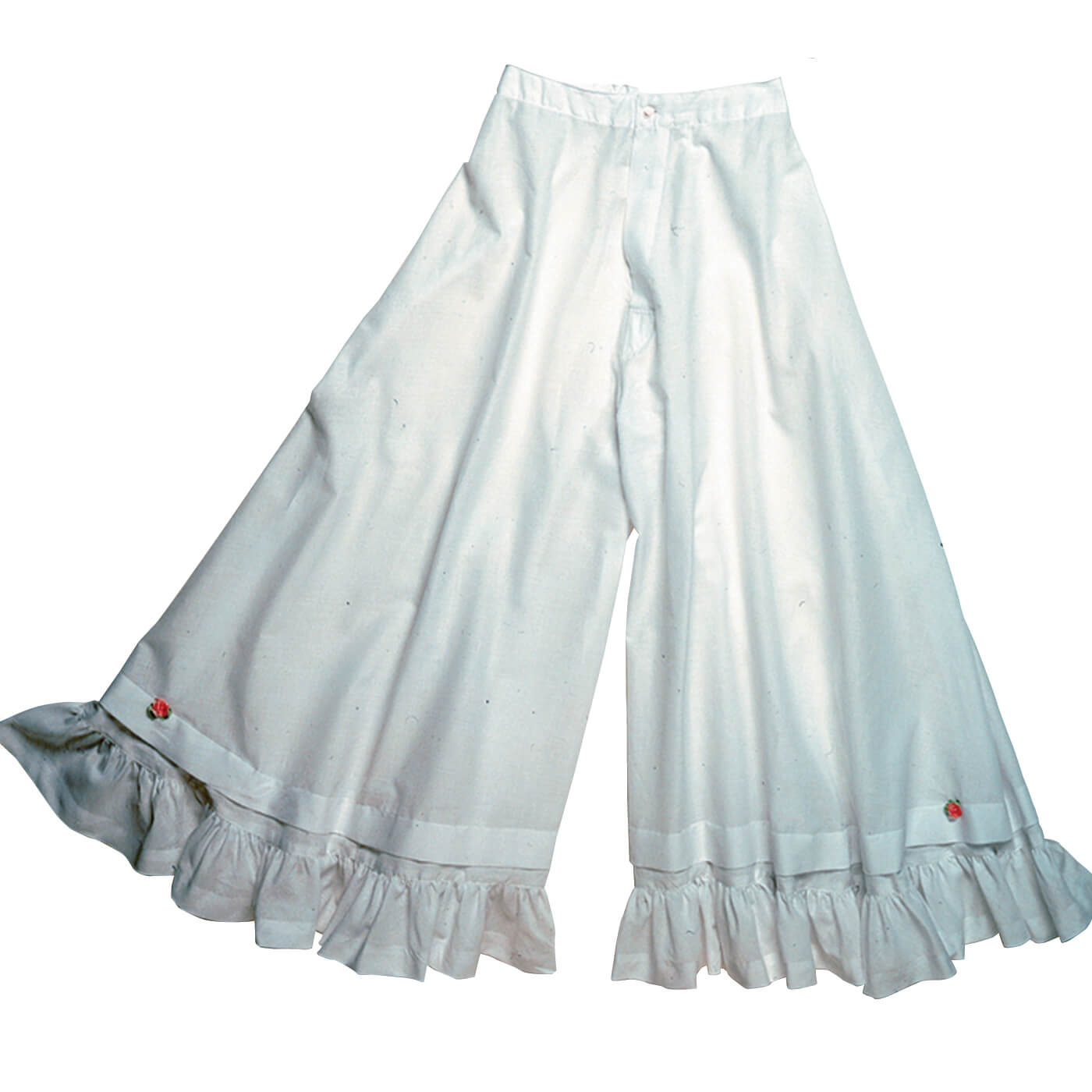 Add a touch of frill as you kick up your heels. These pantaloons can be worn with any Cattle Kate skirt, dress or outfit. It is the perfect split petticoat for our riding skirts. Get some western flair in your undergarments with Cattle Kate's pantaloons. Trimmed in old-fashioned tucks, ruffles and dainty rosettes with an elastic waistband in back and button in the front. Made from 100% fine cotton batiste. Made in USA