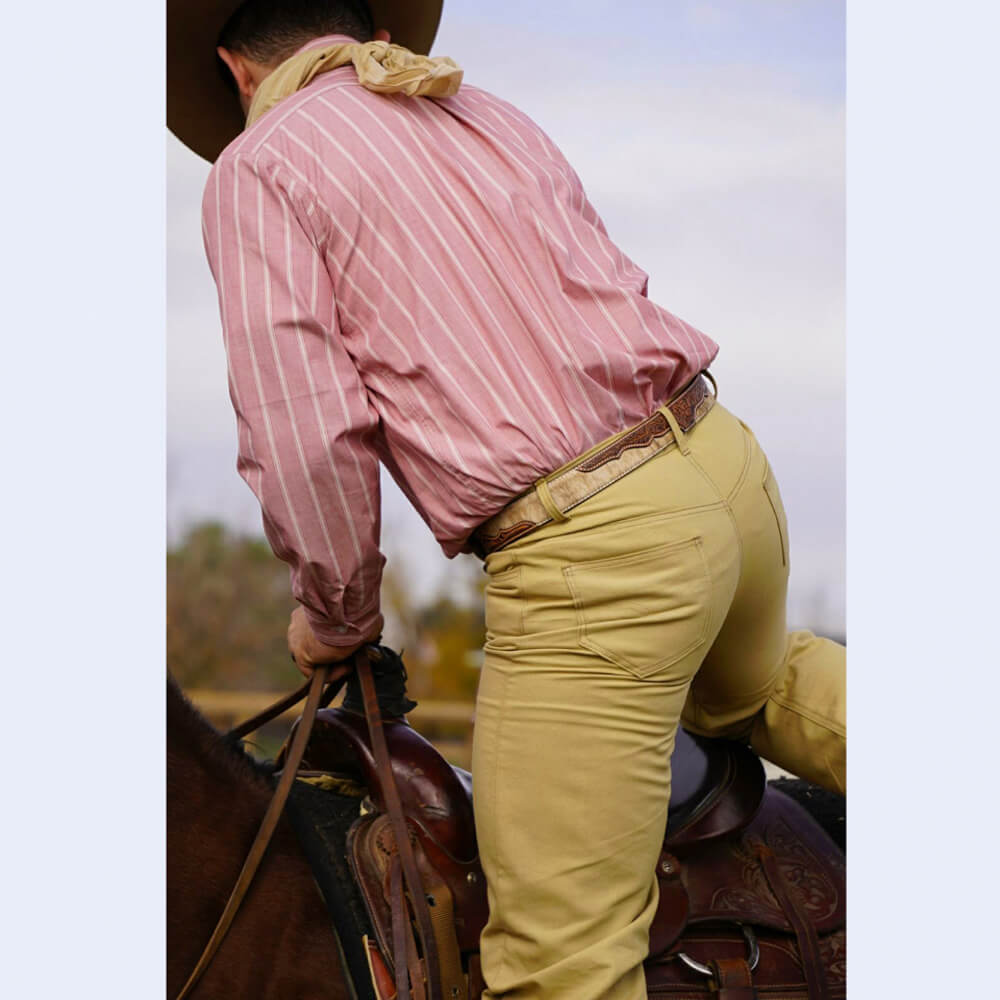 These classic button fly work pants have a jean look and are made of sturdy cotton canvas that matches our Duke Vest. Pants are a regular fit with two front and rear pockets. Belt loops on the waistband. Pant leg made to fit over cowboy boots. The more you wear them the more you’ll love them. 36” inseam.