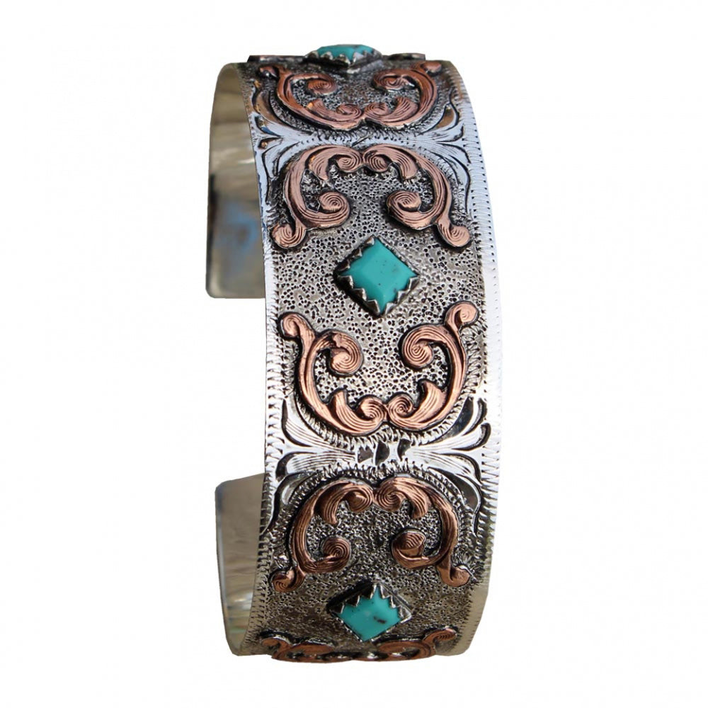 Complete your jewelry ensemble by wearing this western-inspired cuff bracelet. Silver plated with copper accents and faux turquoise stone accents. Made in USA.