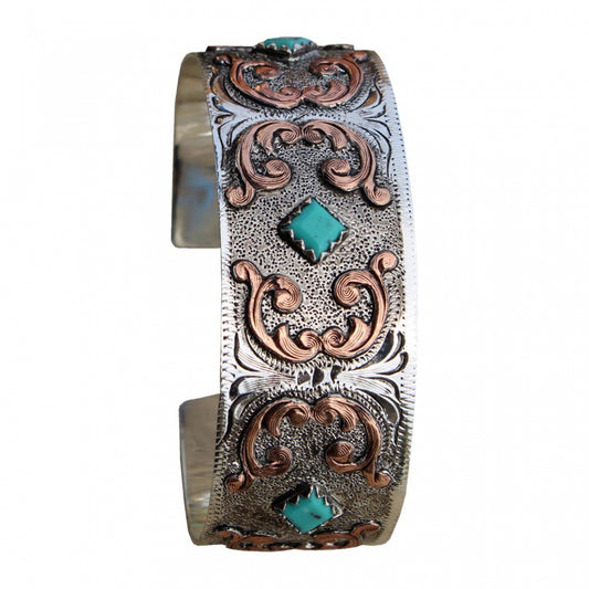 Complete your jewelry ensemble by wearing this western-inspired cuff bracelet. Silver plated with copper accents and faux turquoise stone accents. Made in USA.