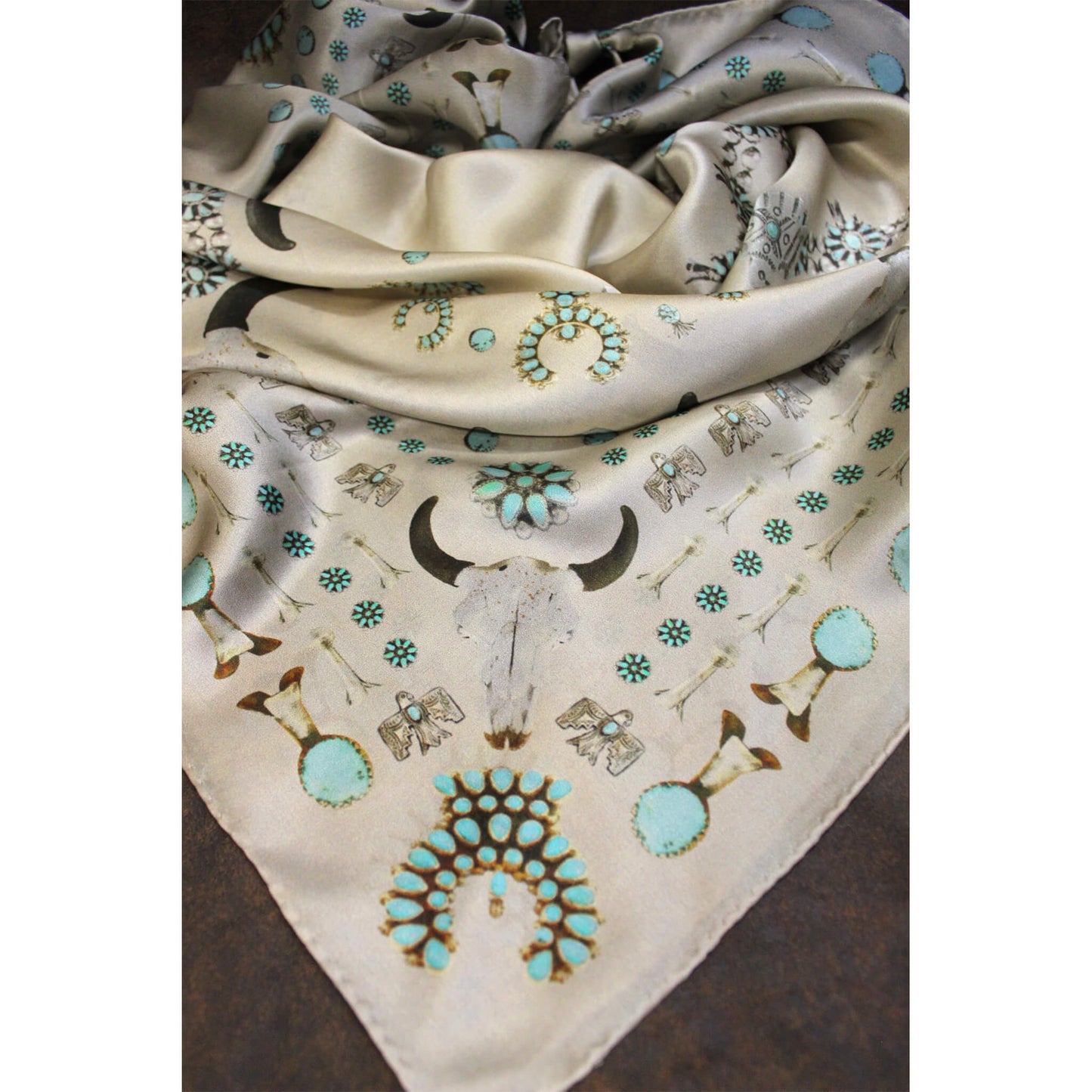 We all love some good vintage turquoise and silver, add to that a buffalo skull and viola... the Squash Blossomed. This wild rag has a rustic, earthy, desert, vintage feel and goes with so many classic inspired outfits. A vintage patina gives it that distressed worn look.