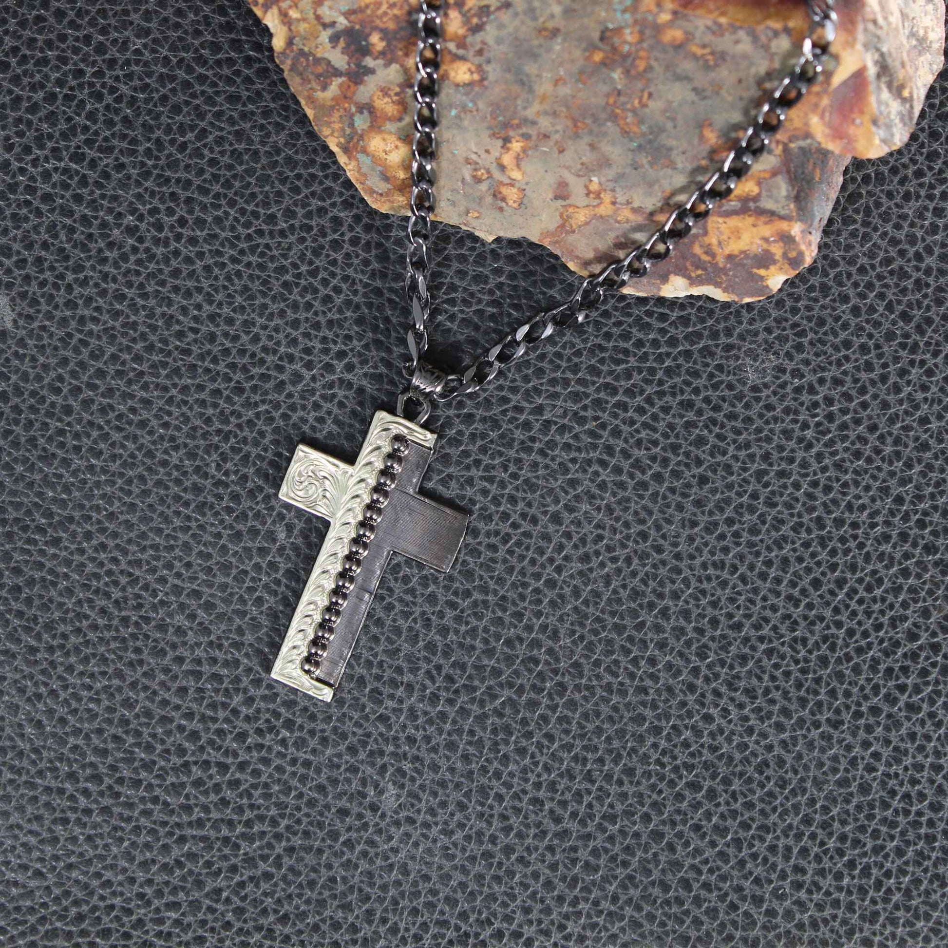 Beautiful cross pendant half antique silver and half gunmetal with a row of silver beads running down the center. Sterling Silver plated. 24 inch chain. Pendant Measures 1-1/2" by 2-1/2"