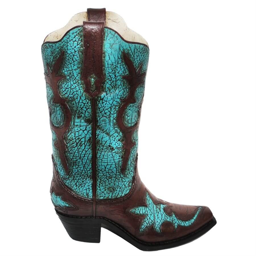 Adorned with a fun, fanciful design, the resin Turquoise Distressed Cowboy Boot Vase holds your artificial flowers with western style. The bright, distressed turquoise cutouts add a punchy contrast to the classic brown. Hand painted, cast resin. Not intended for use with water. Measurement: approx. 12" x 9" x 3"