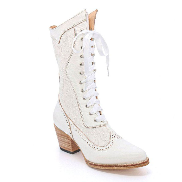 A dreamy wedding boot made for your special day BIDDY. This hand-crafted pair created in nectar rustic with white lace can be your something new. Featuring delicate white lace, satin laces, an alternate set of laces, speed hooks, and pinking details Biddy will bring you delight in every step.