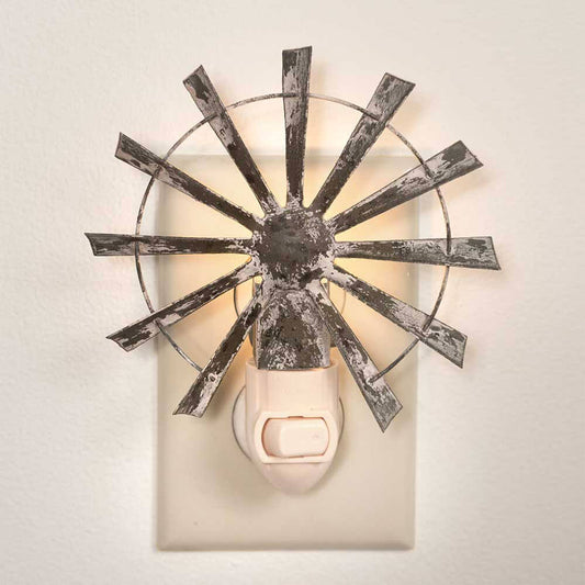 Metal windmill night light makes a great accent for your country home or farmhouse themed decor. A great gift that will add charm anywhere in your home or office. Product Measures 4¾"W x 5½"H with appliance and includes a night light appliance and a 4 watt night light bulb.